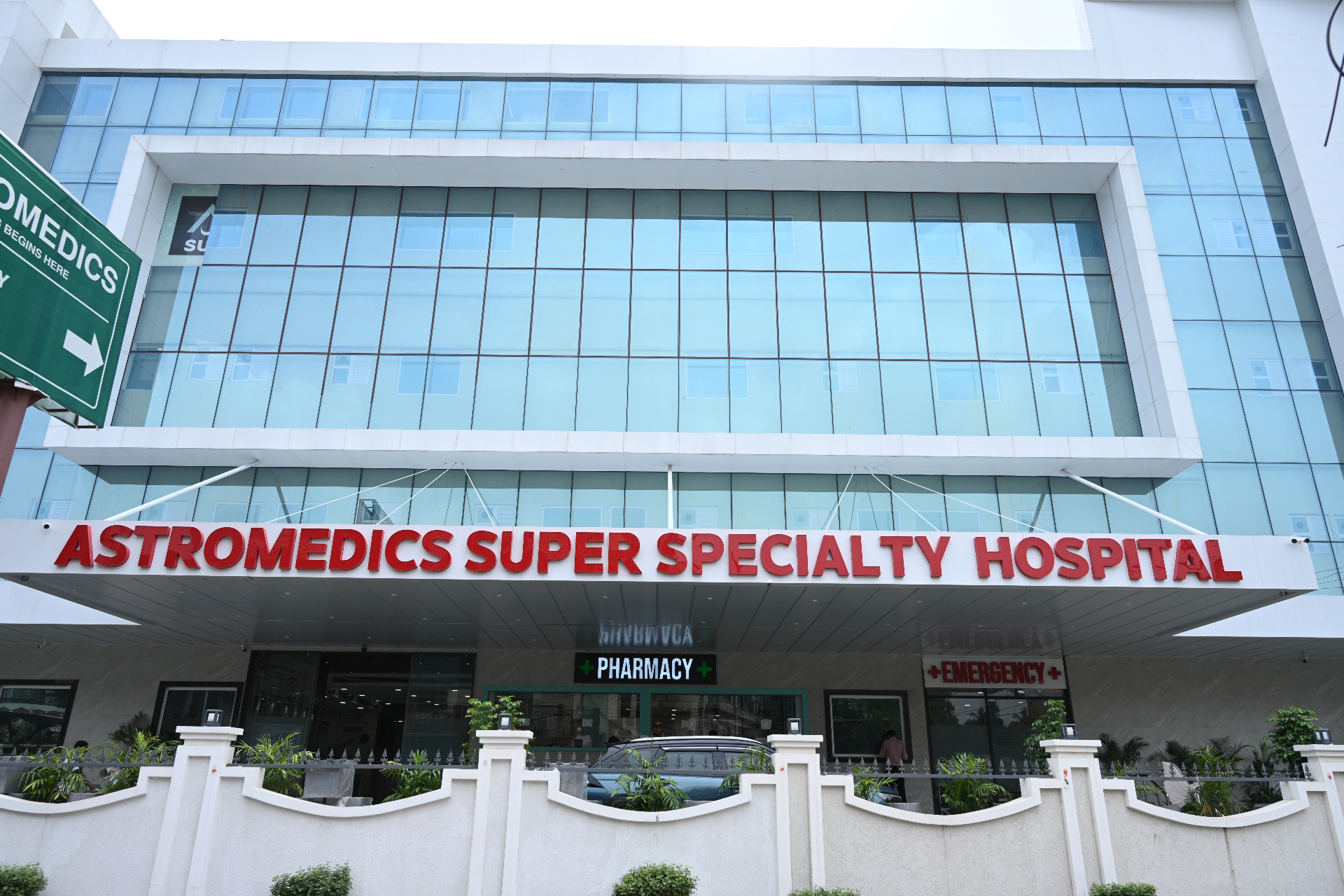ASTROMEDICS Super Speciality Hospital building in Gorakhpur at dusk