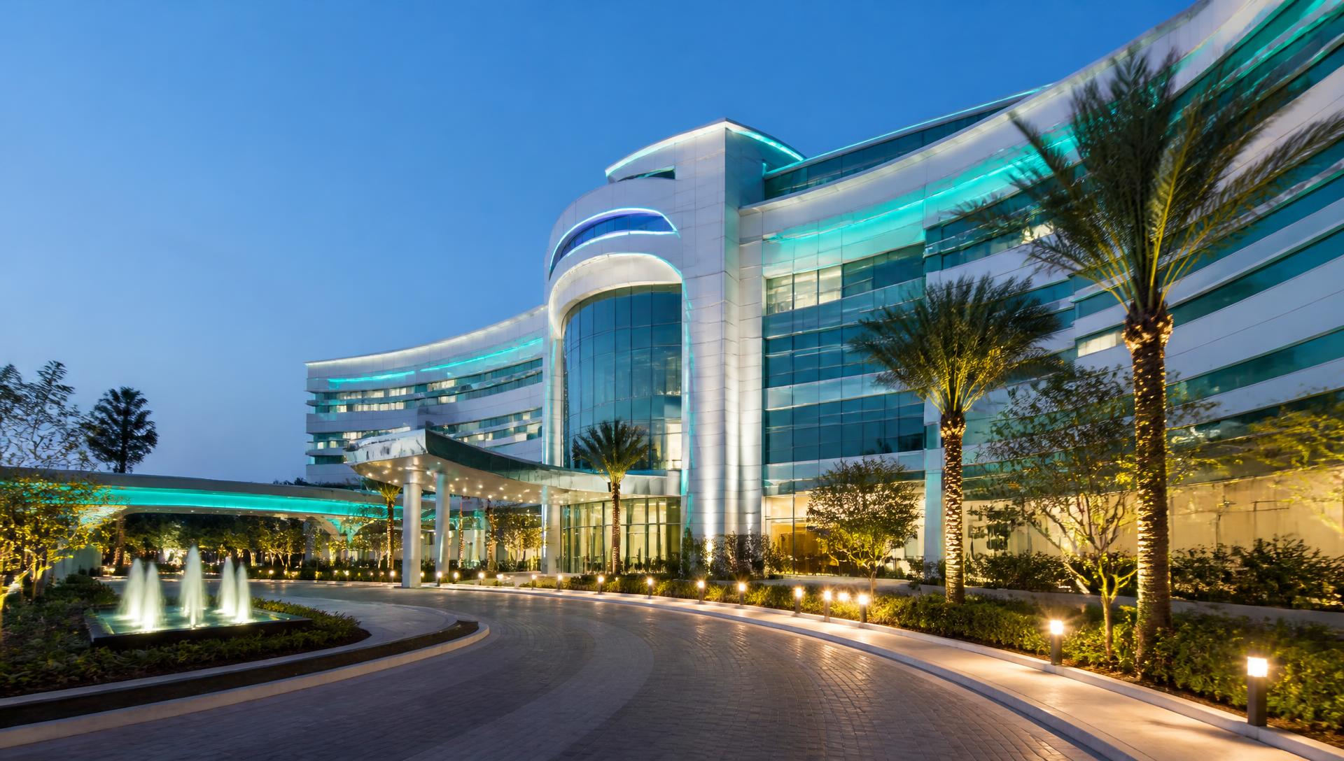 ASTROMEDICS Super Speciality Hospital building in Gorakhpur at dusk